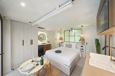 Un ou plusieurs lits dans un hébergement de l'établissement Pavillon 15 Darcy - Appart-suites urbaines & design