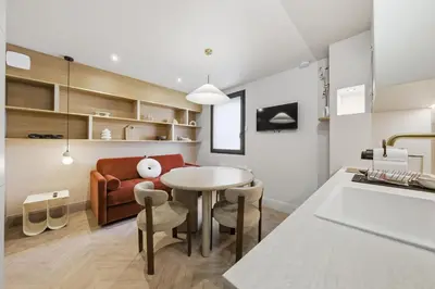 Un ou plusieurs lits dans un hébergement de l'établissement Pavillon 15 Darcy - Appart-suites urbaines & design