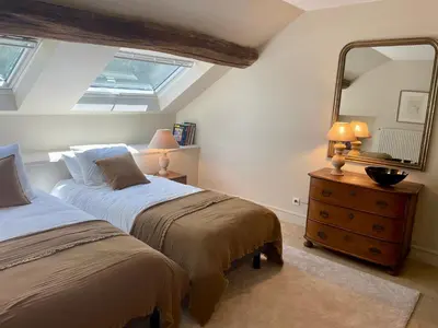 Un ou plusieurs lits dans un hébergement de l'établissement Chambre d'hôtes - Suite familiale accès privatif