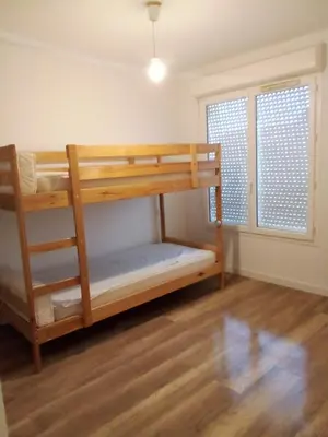 Un ou plusieurs lits dans un hébergement de l'établissement Appartement Mios