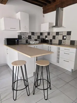 Cuisine ou kitchenette dans l'établissement Au cœur du vieux village