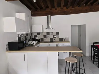 Cuisine ou kitchenette dans l'établissement Au cœur du vieux village