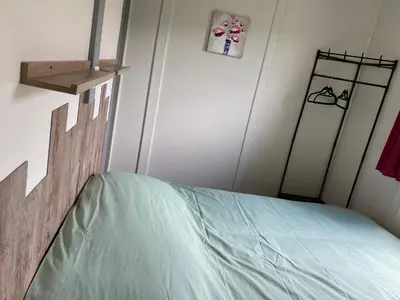 Un ou plusieurs lits dans un hébergement de l'établissement Chalet Iris