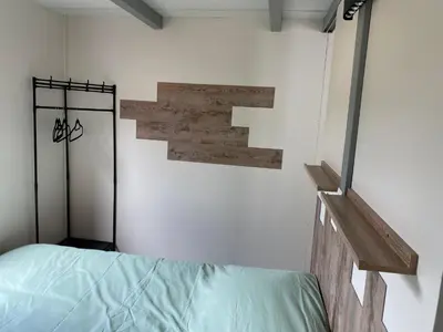 Un ou plusieurs lits dans un hébergement de l'établissement Chalet Iris