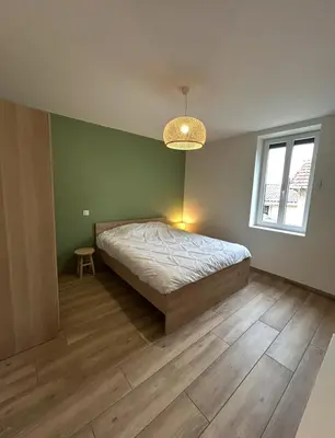 Un ou plusieurs lits dans un hébergement de l'établissement Maison rénovée - Climatisée - Paray-le-Monial - Au bois clair