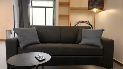 Coin salon dans l'établissement Le chic Calme - Central - Cosy