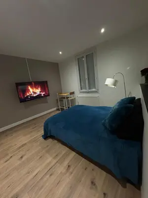Coin salon dans l'établissement Comme à la maison - Chambre et salle de bain privée