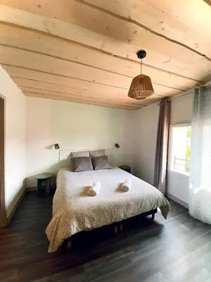 Un ou plusieurs lits dans un hébergement de l'établissement Magnifique maison de village
