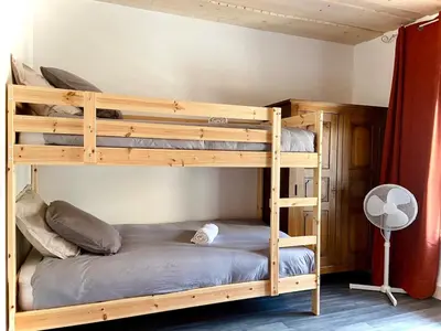 Un ou plusieurs lits dans un hébergement de l'établissement Magnifique maison de village