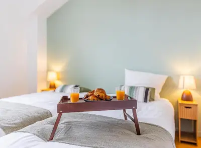 Un ou plusieurs lits dans un hébergement de l'établissement Jardin suspendu - 3 chambres - 2 salles de bain - Parking dans résidence privée