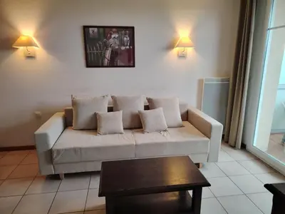 Coin salon dans l'établissement Apartment in Beaune