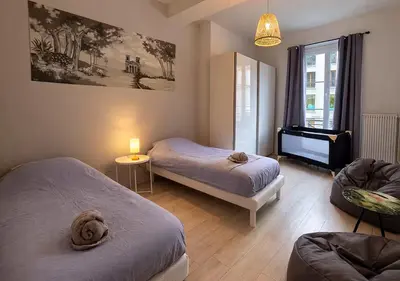 Un ou plusieurs lits dans un hébergement de l'établissement Les Fresques Mâconnaises Central - Luxe - 7pers