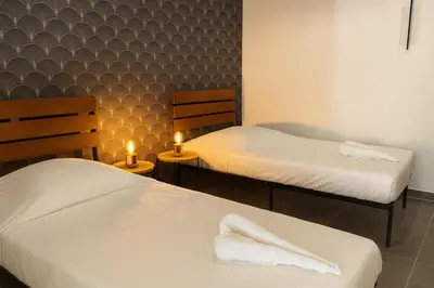 Un ou plusieurs lits dans un hébergement de l'établissement Le Raffiné Central Chic Spacieux