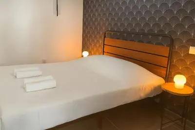 Un ou plusieurs lits dans un hébergement de l'établissement Le Raffiné Central Chic Spacieux
