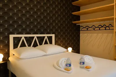 Un ou plusieurs lits dans un hébergement de l'établissement L Évasion Cosy Central Cosy