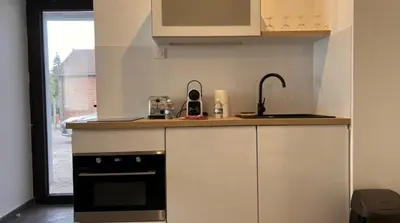 Cuisine ou kitchenette dans l'établissement Le Repaire Calme Central Cosy