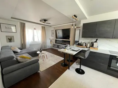 Télévision ou salle de divertissement dans l'établissement Appartement Premium - Le Trente