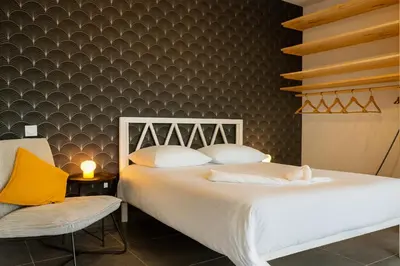 Un ou plusieurs lits dans un hébergement de l'établissement Le Privilège Cosy Central Chic
