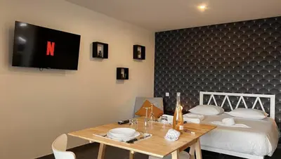 Un ou plusieurs lits dans un hébergement de l'établissement Le Privilège Cosy Central Chic