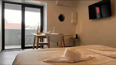 Un ou plusieurs lits dans un hébergement de l'établissement Le Privilège Cosy Central Chic