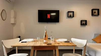 Télévision ou salle de divertissement dans l'établissement Le Privilège Cosy Central Chic