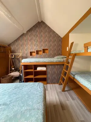 Un ou plusieurs lits dans un hébergement de l'établissement La Maison du bonheur - Gîte PIPA - Corancy