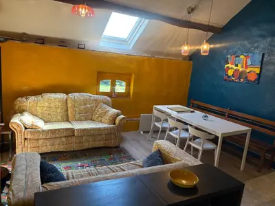 Coin salon dans l'établissement La Maison du bonheur - Gîte PIPA - Corancy