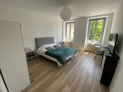 Un ou plusieurs lits dans un hébergement de l'établissement Appartement proche centre ville