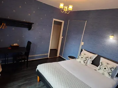 Un ou plusieurs lits dans un hébergement de l'établissement Hôtel JurJura