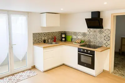 Cuisine ou kitchenette dans l'établissement Une étape à Norges-la-Ville !