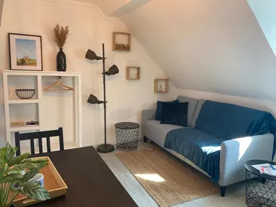 Coin salon dans l'établissement Chez Denise, Studio Cosy au centre-ville
