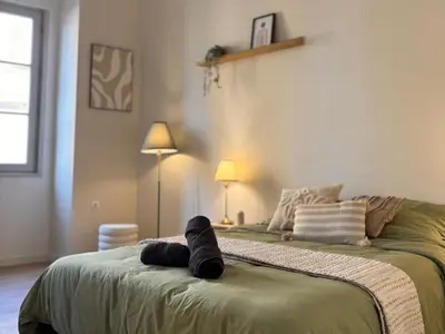 Un ou plusieurs lits dans un hébergement de l'établissement Appartement 6 personnes Paray-le-monial