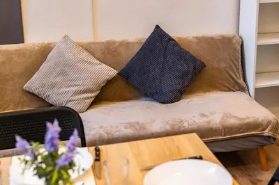 Coin salon dans l'établissement L'Echo de Saint-Michel - Parking Privé - StyleCosy