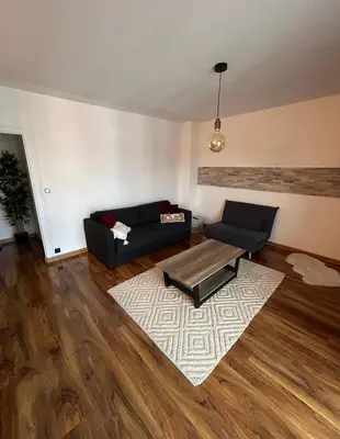 Coin salon dans l'établissement Appartement T2 rénové facultés 5 voyageurs