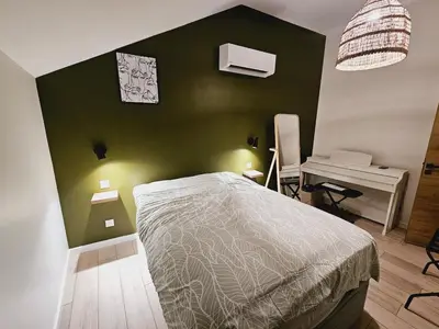 Un ou plusieurs lits dans un hébergement de l'établissement Appartement Spa et Terrasse