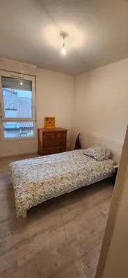 Un ou plusieurs lits dans un hébergement de l'établissement Appartement Duplex