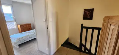 Un ou plusieurs lits dans un hébergement de l'établissement Appartement Duplex