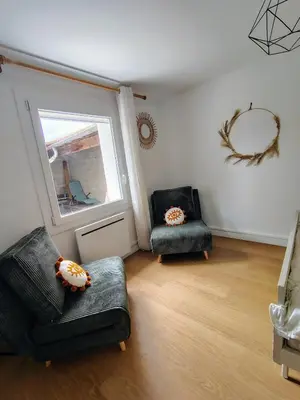 Coin salon dans l'établissement Appartement calme avec jardin