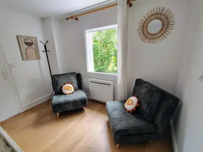 Coin salon dans l'établissement Appartement calme avec jardin