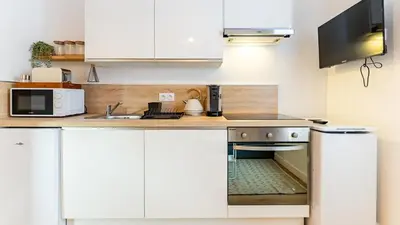 Cuisine ou kitchenette dans l'établissement L'Orangeraie