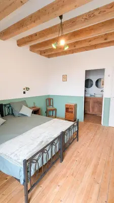 Un ou plusieurs lits dans un hébergement de l'établissement Auberge de la Belette Cendrée