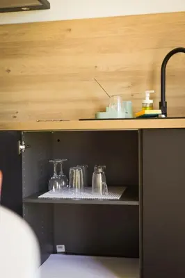 Cuisine ou kitchenette dans l'établissement Appart'HomeStudio Mâcon - PARKING