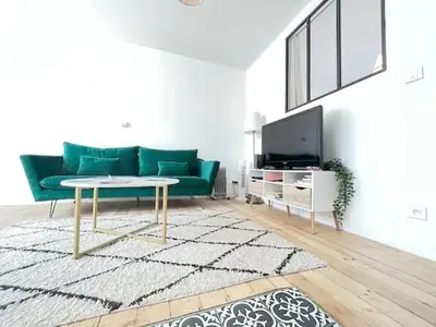 Télévision ou salle de divertissement dans l'établissement Le Philibert - 50m2, 4 Prs, 2 Ch - proche gare