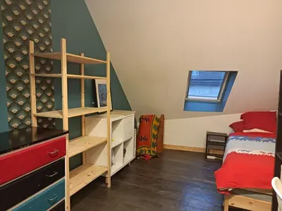 Un ou plusieurs lits dans un hébergement de l'établissement Maison conviviale Tribus, familles et amis