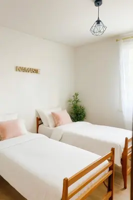 Un ou plusieurs lits dans un hébergement de l'établissement Évasion à Rully grande maison avec piscine privée