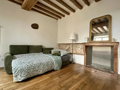 Un ou plusieurs lits dans un hébergement de l'établissement Maison cosy à côté de Beaune