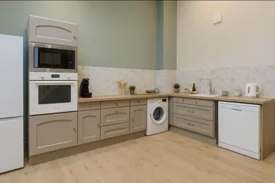 Cuisine ou kitchenette dans l'établissement L Oasis Mâconnaise d Excellence Conciergerie
