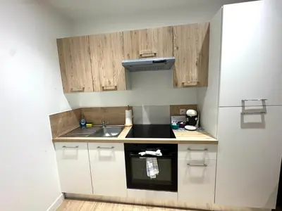 Cuisine ou kitchenette dans l'établissement Appart'Hotel Sennecey - Free Parking
