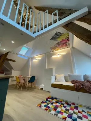 Un ou plusieurs lits dans un hébergement de l'établissement Le loft insolite