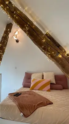 Un ou plusieurs lits dans un hébergement de l'établissement Le loft insolite